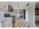 Well-equipped kitchen with stainless steel appliances, island, and view to the Gathering room at 815 Kentucky Ave, St Cloud, FL 34769