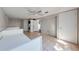 Large laundry area equipped with stacked appliances and tiled flooring adjacent to daybeds providing multi-purpose space at 815 Kentucky Ave, St Cloud, FL 34769