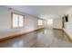 Spacious living room featuring hardwood floors and large windows at 815 Kentucky Ave, St Cloud, FL 34769