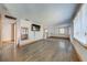 Open concept living room featuring sleek floors, light walls, and natural wood trim at 815 Kentucky Ave, St Cloud, FL 34769