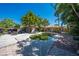 Backyard oasis featuring a free-form pool, seating area, pergola and lush landscaping perfect for relaxing at 815 Kentucky Ave, St Cloud, FL 34769