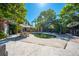 Backyard pool provides a refreshing escape, complemented by surrounding lush greenery and patio furniture at 815 Kentucky Ave, St Cloud, FL 34769