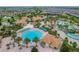 Impressive aerial view of the expansive community pool and surrounding recreation areas, perfect for families at 8817 Cruden Bay Ct, Davenport, FL 33896