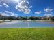 Community basketball court with well maintained blue court and backdrop of townhouses on a sunny day at 8817 Cruden Bay Ct, Davenport, FL 33896