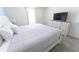 Well-lit bedroom featuring a comfy bed, dresser, and soft colors for a serene atmosphere at 8817 Cruden Bay Ct, Davenport, FL 33896