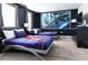 Nicely decorated Star Wars bedroom with two beds, nightstands, and dark blue walls with starry accents at 8817 Cruden Bay Ct, Davenport, FL 33896