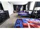 Star Wars themed bedroom with three beds, dark blue walls and starry accents at 8817 Cruden Bay Ct, Davenport, FL 33896