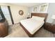 Well-furnished bedroom featuring a queen bed, two matching nightstands, and neutral walls at 8817 Cruden Bay Ct, Davenport, FL 33896