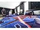 Detailed view of a Star Wars themed bedroom with dark blue walls and carpet flooring at 8817 Cruden Bay Ct, Davenport, FL 33896