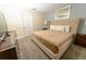 Comfortable bedroom featuring a plush king-size bed, dresser, and soothing neutral color palette at 8817 Cruden Bay Ct, Davenport, FL 33896