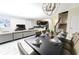 Open concept living space featuring a dining room with seating for eight, connecting to the living room and kitchen at 8817 Cruden Bay Ct, Davenport, FL 33896