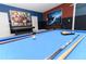 A pool table in a game room with air hockey and foosball offering a fun, activity-filled space at 8817 Cruden Bay Ct, Davenport, FL 33896