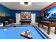 Fun game room with a pool table, foosball, and air hockey for entertainment at 8817 Cruden Bay Ct, Davenport, FL 33896