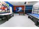 Fun game room with air hockey, foosball, and a pool table, perfect for Gathering entertainment at 8817 Cruden Bay Ct, Davenport, FL 33896