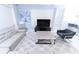 Comfortable living room with modern furniture, patterned rug, and a stylish entertainment center at 8817 Cruden Bay Ct, Davenport, FL 33896