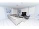 Bright living area featuring a large sectional sofa, modern furnishings, and lots of light at 8817 Cruden Bay Ct, Davenport, FL 33896