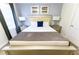 Bright main bedroom with a king-sized bed, stylish lamps, and decorative accents for a comfortable stay at 8817 Cruden Bay Ct, Davenport, FL 33896