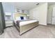 Cozy main bedroom features a king-sized bed, decorative lamps, and framed art for a relaxing retreat at 8817 Cruden Bay Ct, Davenport, FL 33896