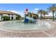 A splash pad with a small water slide provides Gathering fun in the sun with resort-style amenities at 8817 Cruden Bay Ct, Davenport, FL 33896