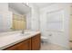 Clean bathroom featuring a vanity with a single sink, a toilet, and a shower/tub combo at 105 Winchester Ln, Haines City, FL 33844