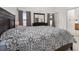 Spacious bedroom with large bed, dresser with a mirror, neutral carpet, and natural lighting at 105 Winchester Ln, Haines City, FL 33844