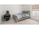 Bedroom with light carpet, rustic wood bed, and a modern salon hair dryer and chair at 105 Winchester Ln, Haines City, FL 33844