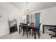 Dining room is illuminated by a modern chandelier and features natural light at 105 Winchester Ln, Haines City, FL 33844