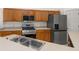 Updated kitchen features a stainless steel range, microwave and refrigerator at 105 Winchester Ln, Haines City, FL 33844