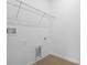 Walk-in closet with shelving for clothes storage, floor tiles and electrical hookups at 1138 Olivine Ave, Dundee, FL 33838