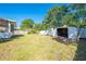 Spacious backyard features a shed and a well-maintained lawn at 1211 Shawnee Dr, Kissimmee, FL 34744