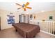 Upstairs bonus room featuring a pool table, carpet floors, and memorabilia at 133 Rona Ln, Davenport, FL 33897