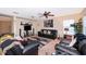 Relaxing living room with ceiling fan, modern décor, and comfortable leather seating at 133 Rona Ln, Davenport, FL 33897