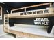 Star Wars-themed bunk beds with custom artwork, perfect for young fans at 1672 Tropical Palms Cir, Kissimmee, FL 34747