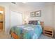 Comfortable bedroom with a double bed, closet, and serene decor for relaxation at 2173 Victoria Dr, Davenport, FL 33837