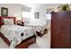 Inviting bedroom with two beds, neutral decor, and a door to the bathroom at 2173 Victoria Dr, Davenport, FL 33837