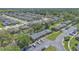 Aerial view showing townhomes, parking, green spaces and proximity to other residential areas at 2435 King Oak Ln, St Cloud, FL 34769