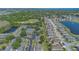 An aerial view of a neighborhood highlighting the green space and water features within the residential community at 2435 King Oak Ln, St Cloud, FL 34769