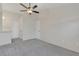 Neutral bedroom featuring plush carpeting, a ceiling fan, and multiple storage options at 2435 King Oak Ln, St Cloud, FL 34769