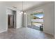 Bright dining area features sliding glass doors to the patio, and neutral paint and tile at 2524 Rapollo Dr, Kissimmee, FL 34741