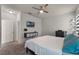 Spacious bedroom features a large bed, ceiling fan, and neutral decor for a tranquil retreat at 2524 Rapollo Dr, Kissimmee, FL 34741