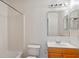 Standard bathroom featuring a tub-shower combo and a vanity with a mirrored medicine cabinet at 258 Grouper Ct, Kissimmee, FL 34759