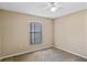 Bedroom with plush carpeting and a bright window at 258 Grouper Ct, Kissimmee, FL 34759