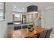 Cozy dining room near the kitchen with tile floors and a view to the staircase at 2621 Corvette Lane, Kissimmee, FL 34746