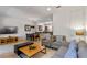 Open-concept living space with kitchen and dining area, perfect for entertaining guests at 2621 Corvette Lane, Kissimmee, FL 34746