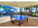 Have fun with friends playing ping pong near the water slide and pool in a shaded patio area at 2621 Corvette Lane, Kissimmee, FL 34746