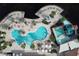 Aerial view showcasing the large resort-style pool with a waterslide and lounge area, perfect for relaxation and fun at 2621 Corvette Lane, Kissimmee, FL 34746