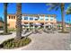 Resort-style pool area with lounge chairs, umbrellas, and well manicured landscaping at 2621 Corvette Lane, Kissimmee, FL 34746