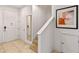 Welcoming foyer with staircase, neutral tones, and artwork at 2621 Corvette Lane, Kissimmee, FL 34746