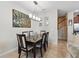 Bright dining room showcasing a modern chandelier and an elegant table with seating at 2920 Windmill Dr, Kissimmee, FL 34741