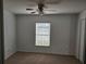 Bright bedroom with a ceiling fan and a window allowing ample natural light at 2921 Puerta Del Sol Blvd, Kissimmee, FL 34744